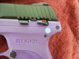 RUGER
LC9-PG,
9-MM,
PURPLE / BLACK,
7 ROUND
MAGAZINE,
Model #:
LC9 Ruger Lady Lilac Talo Edition - 7 of 12