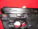 S&W,
M&P- SHIELD,
WITH
LASER,
40
S&W,
COMPACT,
3.1" BARREL,
TWO MAGAZINES,, N.I.B. - 6 of 19