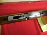 MOSSBERG
22
L.R.
PLINKSTER,
CHROME
WITH
WOOD
STOCK,
10 + 1
ROUNDS,
MODEL # 702 - 7 of 13