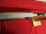 MOSSBERG
22
L.R.
PLINKSTER,
CHROME
WITH
WOOD
STOCK,
10 + 1
ROUNDS,
MODEL # 702 - 3 of 13