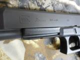 GLOCK
G-35
M.O.S.
THE
ALL
NEW
OPTIC
GLOCK
GUN,
40
S & W,
3 - 15
ROUND
MAGS,
NEW
IN
BOX - 5 of 11