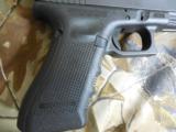 GLOCK
G-34
M.O.S.
GEN. 4,
9 - MM,
WITH
3 - 10
ROUND
MAGAZINES,
GUN
GOOD
IN
MOST
STATES
NEW
IN
BOX - 7 of 15