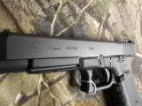 GLOCK
G-34
M.O.S.
THE
OPTIC
SIGHT
GLOCK
GUN,
9 - MM ,
3 - 17
ROUND
MAGS,
NEW
IN
BOX
FREE 33 RD.MAG W/ GUN - 12 of 26