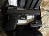 GLOCK
G-40
M.O.S.
THE
ALL
NEW
OPTIC
GLOCK
GUN,
10 -
MM,
3 - 15
ROUND
MAGS,
WITH
TRIJICON
RMR
R.D.
SIGHT
NEW
IN
BOX - 2 of 23
