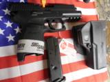 SIG / SAUER
P 250C,
357 SIG,
WITH
FREE
SIG
HOLSTER,
2 -13 + 1
ROUND
MAGAZINE,
COMBAT
SIGHTS,
NEW
IN
BOX - 4 of 17
