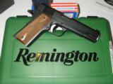 REMINGTON
1911
R1,
45 A.C.P.
WALNUT
GRIPS,
2 - 7
ROUND
MAGAZINES,
5.0"
BARREL,
BLUED,
FACTORY
NEW
IN
BOX
- 1 of 15
