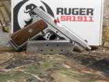 RUGER
SR1911
STAINLESS
STEEL
45
A.C.P.
2-8+1 RD. MAGAZINES, HARDWOOD
GRIPS,
FACTORY
NEW
IN
BOX - 20 of 25