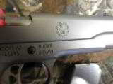 RUGER
SR1911
STAINLESS
STEEL
45
A.C.P.
2-8+1 RD. MAGAZINES, HARDWOOD
GRIPS,
FACTORY
NEW
IN
BOX - 15 of 25