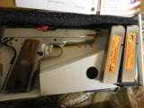 RUGER
SR1911
STAINLESS
STEEL
45
A.C.P.
2-8+1 RD. MAGAZINES, HARDWOOD
GRIPS,
FACTORY
NEW
IN
BOX - 2 of 25