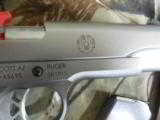 RUGER
SR1911
STAINLESS
STEEL
45
A.C.P.
2-8+1 RD. MAGAZINES, HARDWOOD
GRIPS,
FACTORY
NEW
IN
BOX - 3 of 25