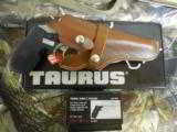 TAURUS
JUDGE,
STAINLESS
STEEL,
45 LONG / 410,
3.0" BARREL,
CRIMSON
TRACE
LASER,
LEATHER
HOLSTER,
ALL
FACTORY
NEW
IN
BOX - 11 of 25