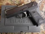 RUGERP-94,40 S & W,PREOWNED( LIKE NEW ),2 - 10ROUNDMAGAZINES,COMBATSIGHTS,AMBIDEXTROUSSAFETY,4.0"BARREL,ALLBLAC - 14 of 20