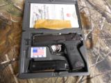 RUGERP-94,40 S & W,PREOWNED( LIKE NEW ),2 - 10ROUNDMAGAZINES,COMBATSIGHTS,AMBIDEXTROUSSAFETY,4.0"BARREL,ALLBLAC - 1 of 20