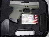 GLOCK
G- 43 USA
9MM, Cerakote
Forest
Green, Cerakote
Shimmering
Aluminum,
2- 6 RD.MAGS,
FACTORY
NEW
IN
BOX - 14 of 22