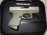 GLOCK
G- 43 USA
9MM, Cerakote
Forest
Green, Cerakote
Shimmering
Aluminum,
2- 6 RD.MAGS,
FACTORY
NEW
IN
BOX - 12 of 22