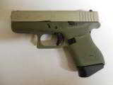 GLOCK
G- 43 USA
9MM, Cerakote
Forest
Green, Cerakote
Shimmering
Aluminum,
2- 6 RD.MAGS,
FACTORY
NEW
IN
BOX - 2 of 22