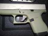 GLOCK
G- 43 USA
9MM, Cerakote
Forest
Green, Cerakote
Shimmering
Aluminum,
2- 6 RD.MAGS,
FACTORY
NEW
IN
BOX - 13 of 22