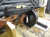 THOMPSON 1927-A1
.45 ACP
W / 100
ROUND
DRUM
&
30 RND. MAG.,
AJJUSTABLE
SIGHTS,
16.5"
BARREL,
WALNUT
STOCK,
FACTORY
NEW
IN
- 14 of 25