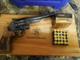 SMITH & WESSON,
DIRTY
HARRY,
MODLE
29,
44
MAGNUM,
COCOBOLO WOOD
GRIPS,
6.5"
BARREL, W
/ Wooden Display Case,
NEW IN BOX - 18 of 25