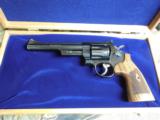 SMITH & WESSON,
DIRTY
HARRY,
MODLE
29,
44
MAGNUM,
COCOBOLO WOOD
GRIPS,
6.5"
BARREL, W
/ Wooden Display Case,
NEW IN BOX - 10 of 25