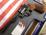 SMITH & WESSON,
DIRTY
HARRY,
MODLE
29,
44
MAGNUM,
COCOBOLO WOOD
GRIPS,
6.5"
BARREL, W
/ Wooden Display Case,
NEW IN BOX - 2 of 25