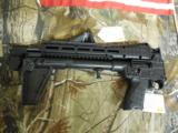 KEL-TEC
SUB-2000, GLK-17,
9 - MM,
BLACK,
USES
GLOCK
MAGAZINES.
FOLDING
RIFLE,
COMES
WITH ONE
17
ROUND
MAGAZINE,
FACTORY
NEW
IN
BOX
- 5 of 25