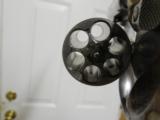 S&WM / 66,STAINLESSSTEEL,357 / 38REVOLVER,4"BARREL6SHOT,WOODGRIPS,ADJUSTABLEREARSIGHT,REDFRONTRAMP,LIKENEW. - 13 of 22