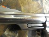 S&WM / 66,STAINLESSSTEEL,357 / 38REVOLVER,4"BARREL6SHOT,WOODGRIPS,ADJUSTABLEREARSIGHT,REDFRONTRAMP,LIKENEW. - 11 of 22