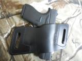 HOLSTER,
VERSACARRY
QUICK
SLIDE
S1
OWB
AMBIDEXTROUS
SIZE
3
BLACK
HI
QUALITY
LEATHER - 6 of 25