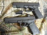 GLOCK
G-34
M.O.S.
GEN. 4,
9 - MM,
WITH
3 - 10
ROUND
MAGAZINES,
FACTORY
NEW
IN
BOX - 1 of 26