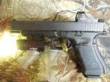 GLOCK
G-34
M.O.S.
GEN. 4,
9 - MM,
WITH
3 - 10
ROUND
MAGAZINES,
FACTORY
NEW
IN
BOX - 6 of 26