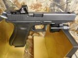 GLOCK
G-34
M.O.S.
GEN. 4,
9 - MM,
WITH
3 - 10
ROUND
MAGAZINES,
FACTORY
NEW
IN
BOX - 11 of 26