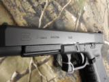 GLOCK
G-34
M.O.S.
GEN. 4,
9 - MM,
WITH
3 - 10
ROUND
MAGAZINES,
FACTORY
NEW
IN
BOX - 15 of 26