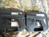 GLOCK
G-34
M.O.S.
GEN. 4,
9 - MM,
WITH
3 - 10
ROUND
MAGAZINES,
FACTORY
NEW
IN
BOX - 4 of 26