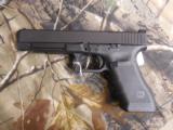 GLOCK
G-34
M.O.S.
GEN. 4,
9 - MM,
WITH
3 - 10
ROUND
MAGAZINES,
FACTORY
NEW
IN
BOX - 9 of 26