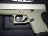 GLOCK
G- 43 USA
9MM, Cerakote
Forest
Green, Cerakote
Shimmering
Aluminum,
2- 6 RD.MAGS,
FACTORY
NEW
IN
BOX - 13 of 24