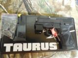 TAURUS
PT 111 GEN 2,
9-MM
WITH
LASER,
2- 12 ROUND
MAGAZINES,
COMBAT
SIGHTS.
3.3"
BARREL,
FACTROY
NEW
IN
BOX.. - 2 of 25