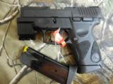 TAURUS
PT 111 GEN 2,
9-MM
WITH
LASER,
2- 12 ROUND
MAGAZINES,
COMBAT
SIGHTS.
3.3"
BARREL,
FACTROY
NEW
IN
BOX.. - 4 of 25