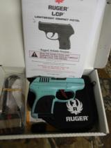 RUGER
LCP
380,
CUSTOM
CERAKOTE
TIFFANY
FINISH,
6+1
ROUND
MAGAZINE,
CERRING
POUCH,
FACTORY
NEW
IN
BOX - 1 of 20