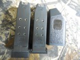 GLOCK
G-27
GENERATION - 3,
WHITE
SIGHTS,
PRE
OWNED,
3.5"
BARREL, 1-11 & 1-9
ROUND
MAGAZINE,
AND
GLOCK
PLASTIC
HARD
CASE. WITH
M - 12 of 18