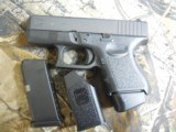 GLOCK
G-27
GENERATION - 3,
WHITE
SIGHTS,
PRE
OWNED,
3.5"
BARREL, 1-11 & 1-9
ROUND
MAGAZINE,
AND
GLOCK
PLASTIC
HARD
CASE. WITH
M - 5 of 18