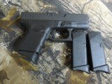 GLOCKG-27GEN4,PEOWNED,LIKENEW, 40 S & W,3.42" BARREL,WHITEOUTLINESIGHTS,3- 11+1 MAGS., Black Interchangeable Backstrap, - 7 of 20
