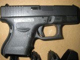 GLOCK
G- 26,
GENERATION
4,
FS,
9-MM,
WHITE
OUTLINE
SIGHTS,
3 -10+1 - ROUND
MAGAZINES,
INTERCHANGABLE BACKSTRAPS,
FACTORY
NEW
IN
BOX - 5 of 21