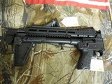 KEL-TEC
SUB-2000, GLK-17,
9 - MM,
BLACK,
USES
GLOCK
MAGAZINES.
FOLDING
RIFLE,
COMES
WITH ONE
17
ROUND
MAGAZINE,
FACTORY
NEW
IN
BOX - 6 of 25