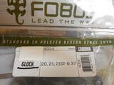 GLOCK
HOLSTERS, G- 20, 21, 21SF, 37
FOBUS
TACTICAL,
PADDLE
HOLSTER,
RIGHT
HAND,
GLOCK
GUNS
WITH
LASERS
OR
LIGHTS
ON
RAIL, NEW IN BOX. - 2 of 16