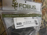 GLOCK
HOLSTERS, G- 19, 23, &, 32,
FOBUS
TACTICAL,
PADDLE
HOLSTER,
RIGHT
HAND,
GLOCK
GUNS
WITH
LASERS
OR
LIGHTS
ON
RAIL, NEW IN BOX. - 2 of 19