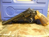 SMITH & WESSON,
DIRTY
HARRY,
MODLE
29-10,
44
MAGNUM,
COCOBOLO WOOD
GRIPS,
6.5"
BARREL ,COMES
WITH Wooden Display Case,
FACTORY
NEW I - 4 of 25
