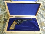 SMITH & WESSON,
DIRTY
HARRY,
MODLE
29-10,
44
MAGNUM,
COCOBOLO WOOD
GRIPS,
6.5"
BARREL ,COMES
WITH Wooden Display Case,
FACTORY
NEW I - 7 of 25