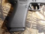 GLOCK
48,
THE JUST OUT GLOCK 48,
9-MM
LUGER FS 10-SHOT BLACK FRAME SILVER SLIDE,
2- MAGAZINES,
4"
BARREL,
FACTORY
NEW
IN
BOX. - 9 of 22