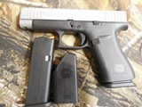 GLOCK
48,
THE JUST OUT GLOCK 48,
9-MM
LUGER FS 10-SHOT BLACK FRAME SILVER SLIDE,
2- MAGAZINES,
4"
BARREL,
FACTORY
NEW
IN
BOX. - 6 of 22